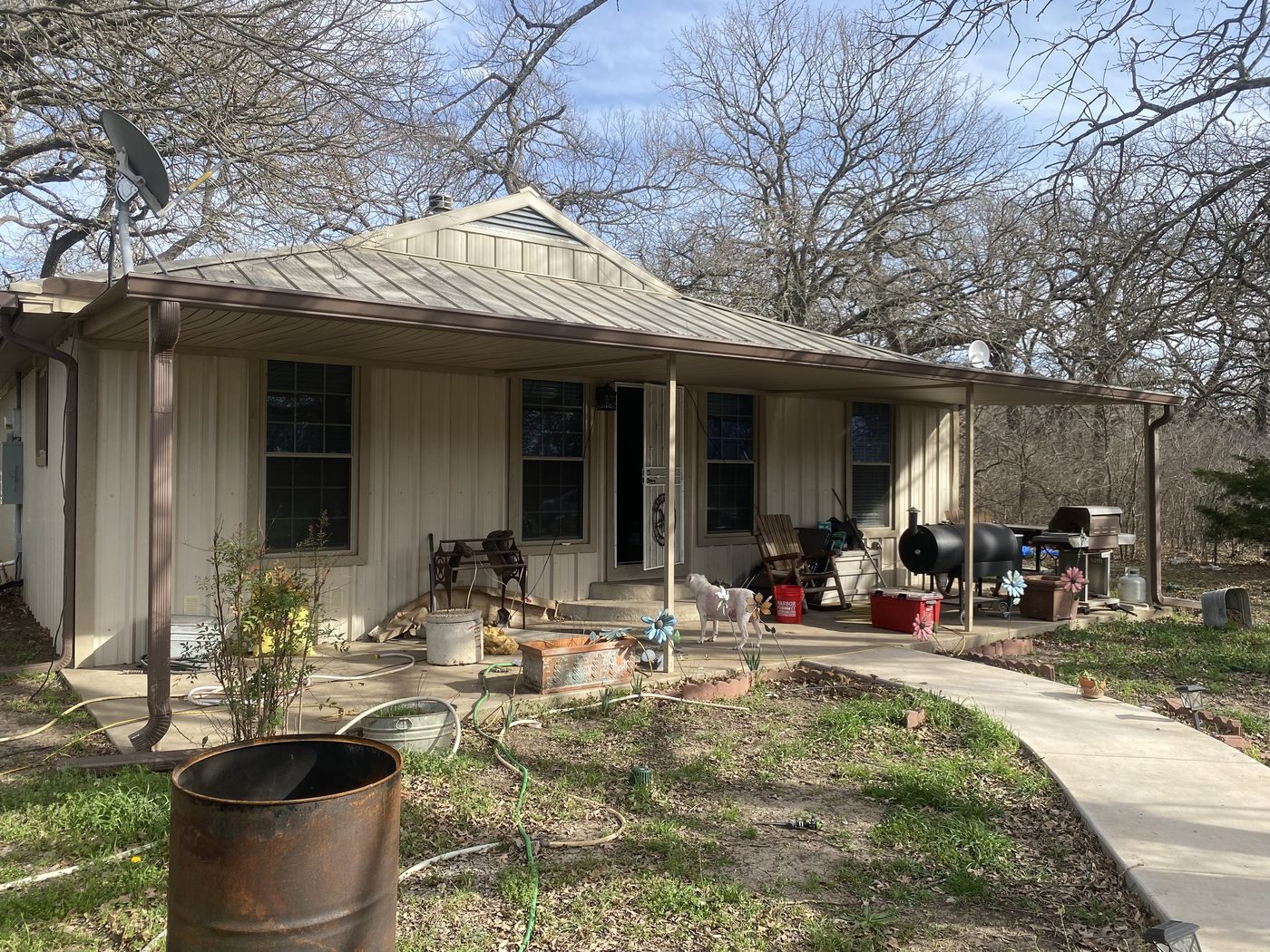 Porch rebuild with new cedar columns and railing - before